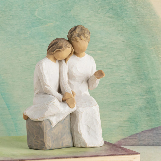 Willow Tree With my Grandmother, 5.5" hand-painted resin figure of older woman seated on gray bench, holding hands with young girl, both in cream dresses, in front of muted green painting