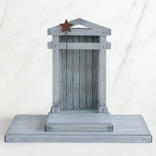 Grey wooden barn figurine open - brown star standing on it