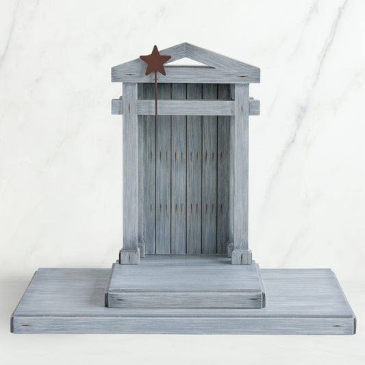 Grey wooden barn figurine open - brown star standing on it