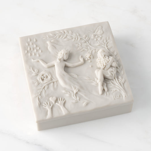 Closed white resin box; lid carved with figural and organic imagery
