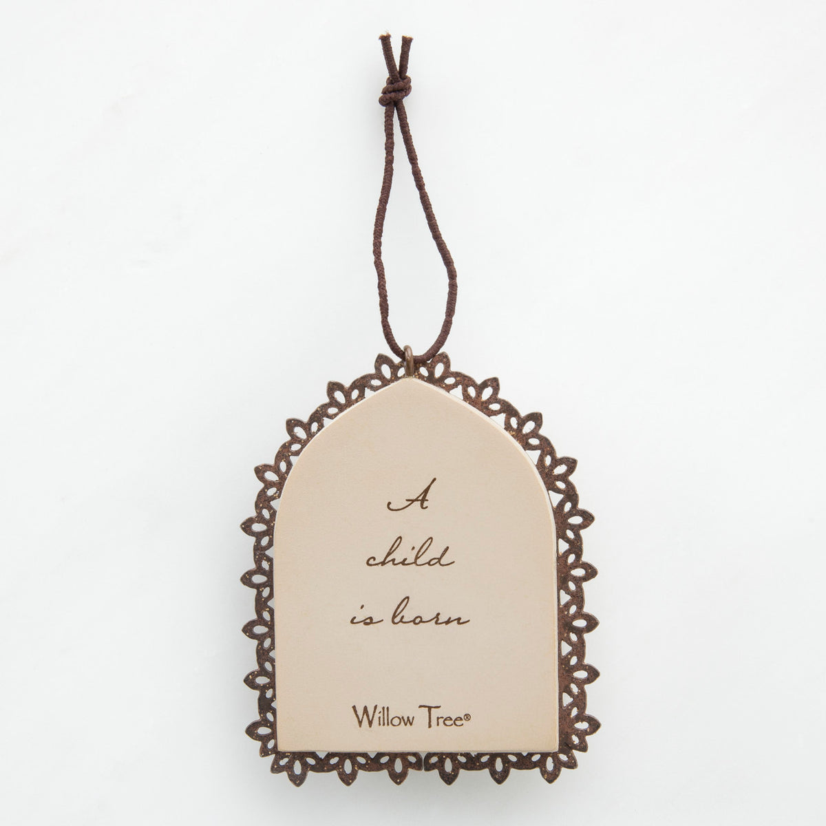 Round cream pendant with wooden outline - center says 'a child is born'