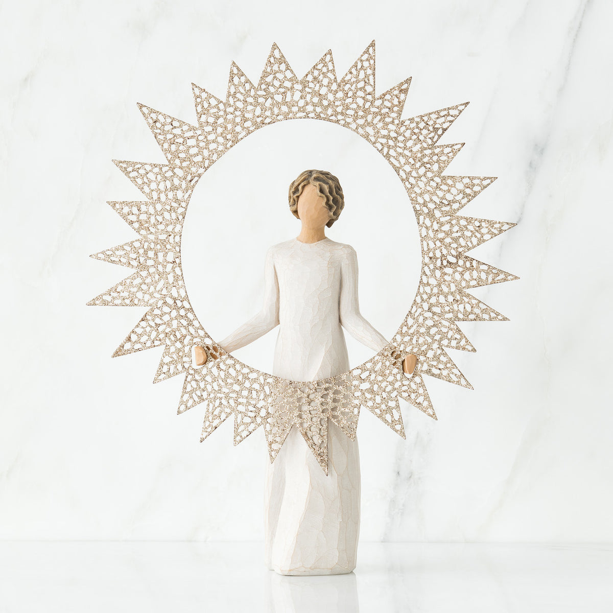 Brunette girl figurine in white dress standing facing forward holding large sun figurine