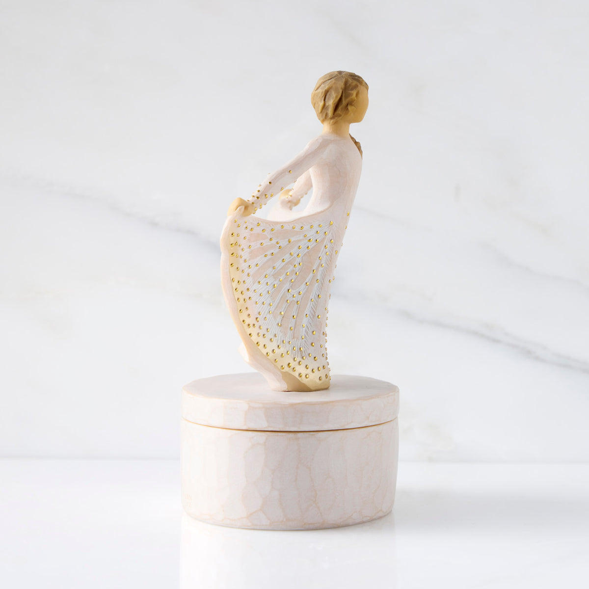 Right view: oval resin box, with profile of 3-D figure in cream and gold carved dress