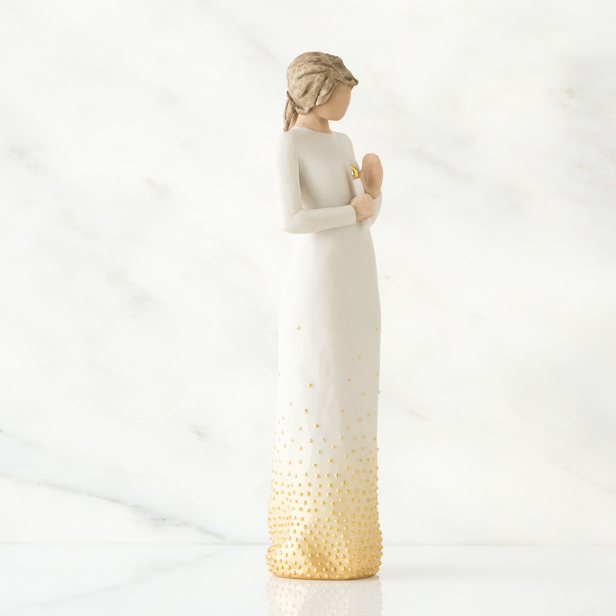 Side view of brunette woman wearing white dress with golden bottom