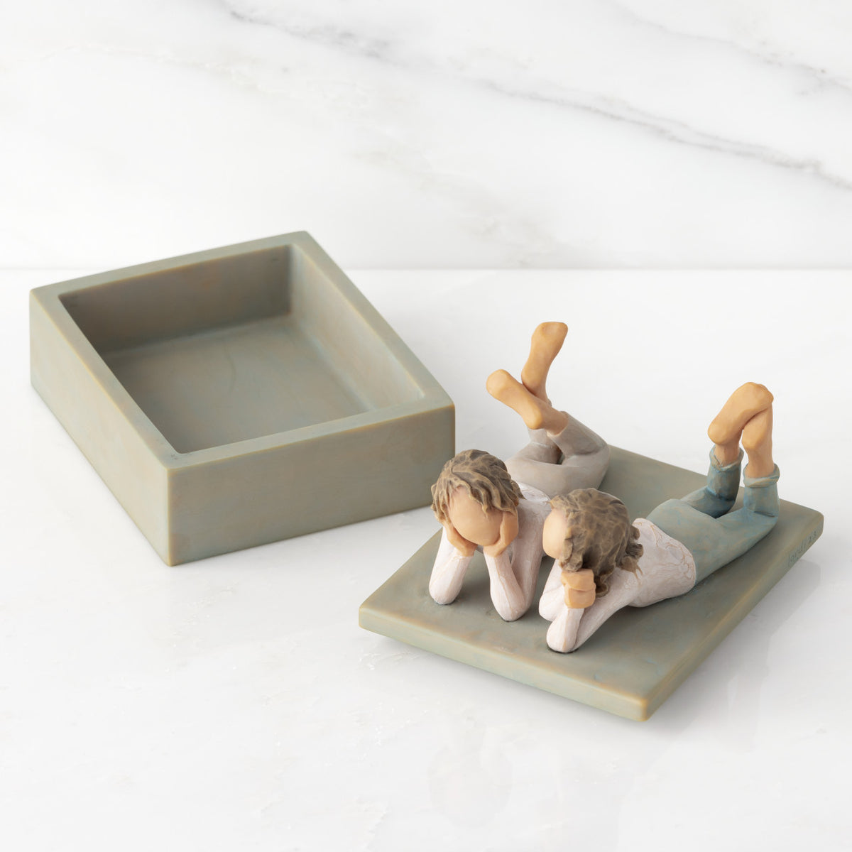 Open rectangular blue-gray resin box, detached lid, showing inside of box