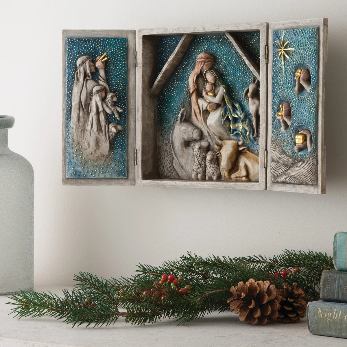 Willow Tree Starry Night Nativity, 8.5”h x 8”w x 2”d resin triptych with hinged doors, cream exterior with gold and blue details, doors open to 16”w with interior bas-relief Nativity scenes, hanging on wall with doors open